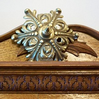 One of the brass and wood ornaments. One of the brass and wood ornaments